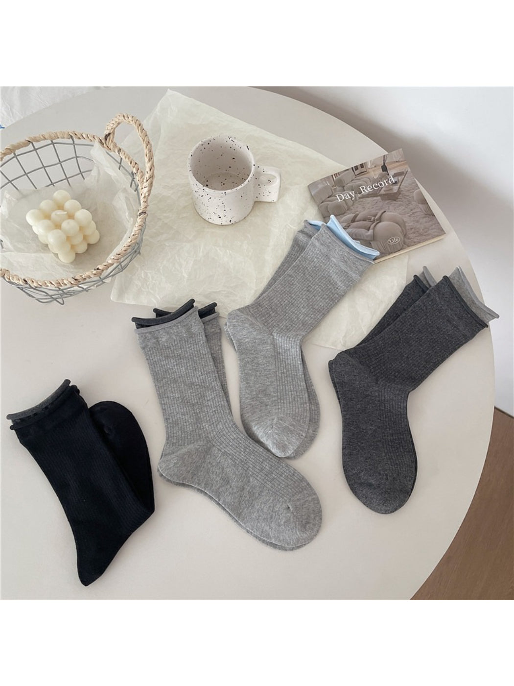 Rufia casual roll cuff crew socks paired with denim jeans on model
