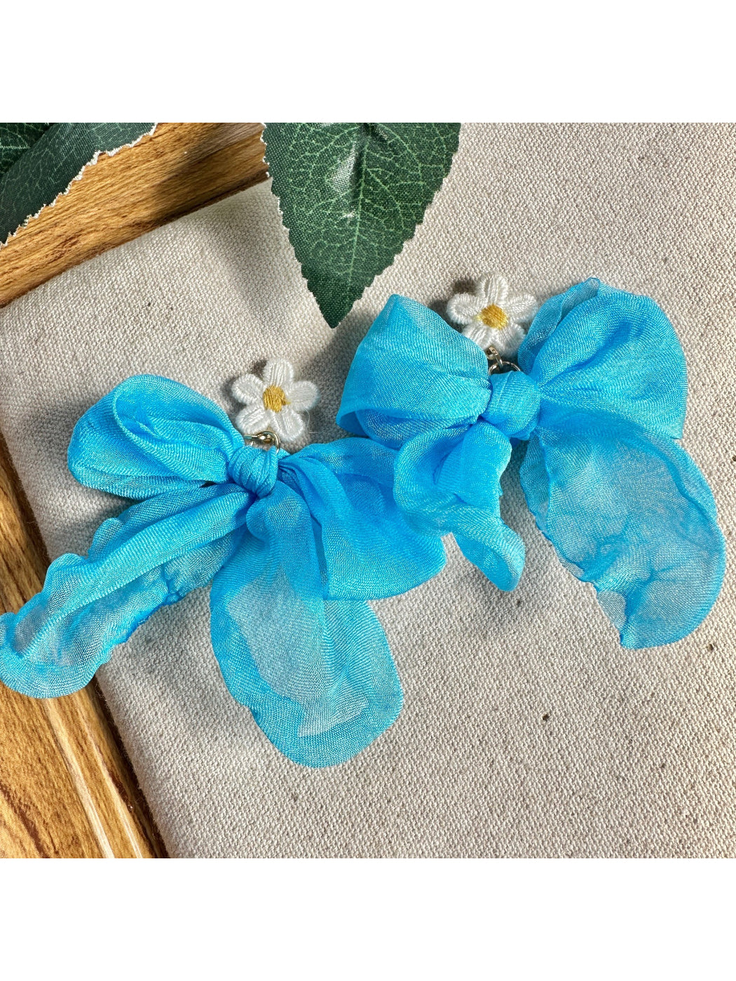 Earwish soft ribbon daisy earrings displayed on a white background showing front view