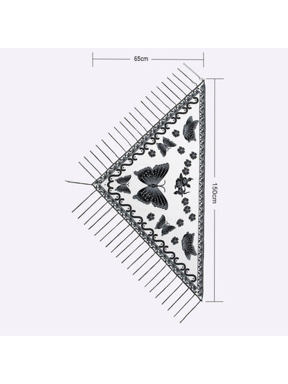 Close-up of Scarvii Butterfly Fringe Triangle Scarf fabric texture and butterfly print