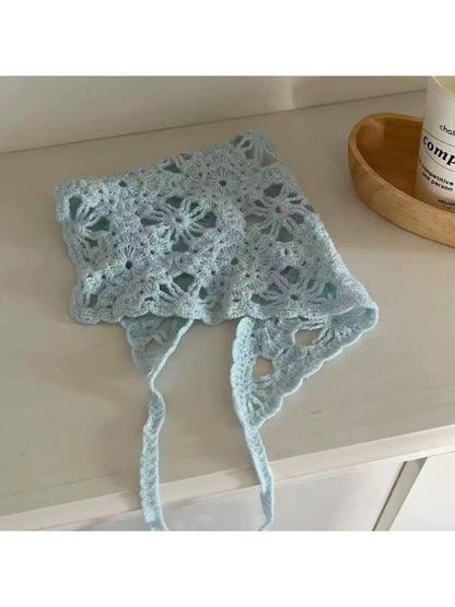 Side view of the scarf showing its triangular shape and texture