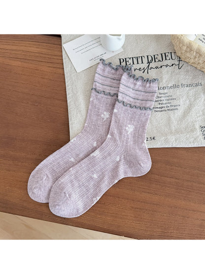 Side view of Rufia floral crew socks highlighting floral design and frill trim