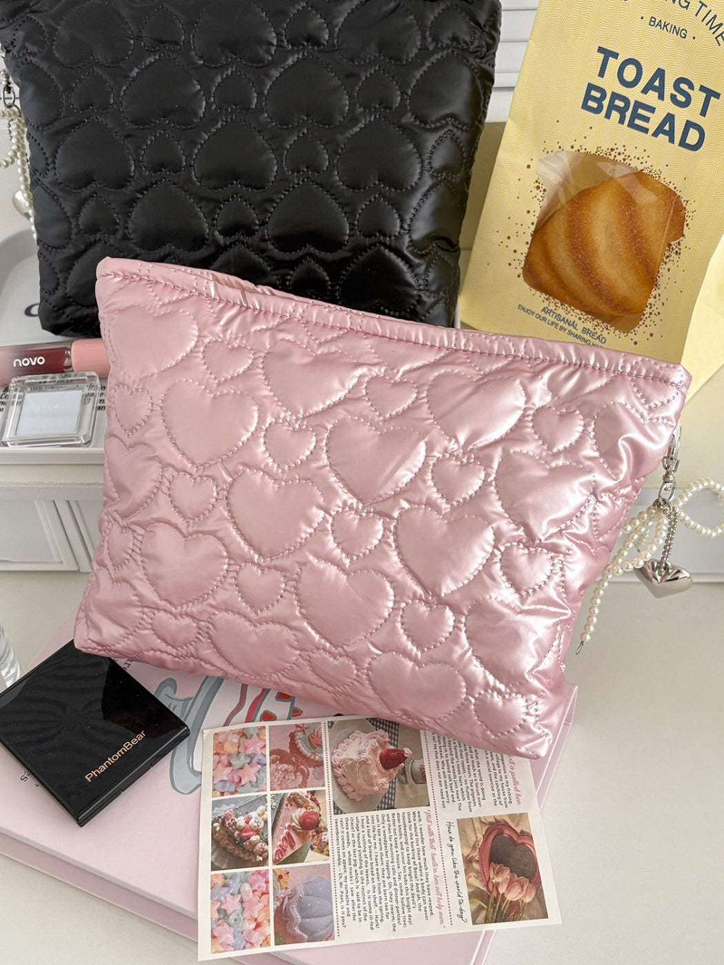 Cosbai heart pattern cosmetic bag with zipper partially open