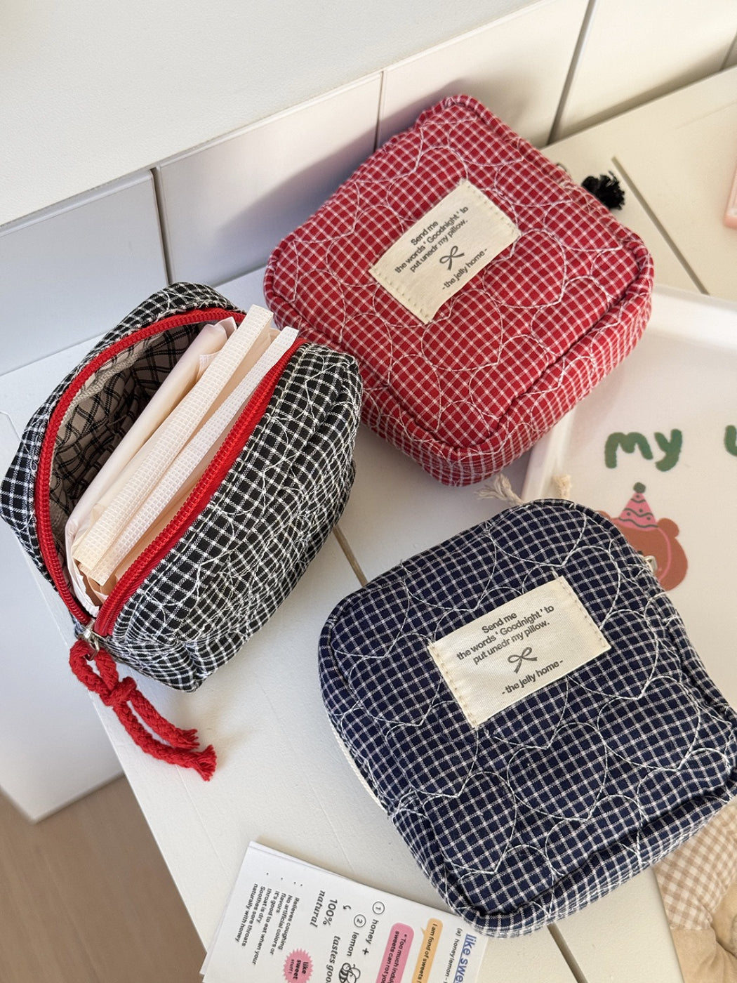 Side view of Cosbai soft quilted travel pouch highlighting thickness
