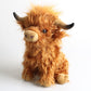 Cow plush toy with embroidered face details