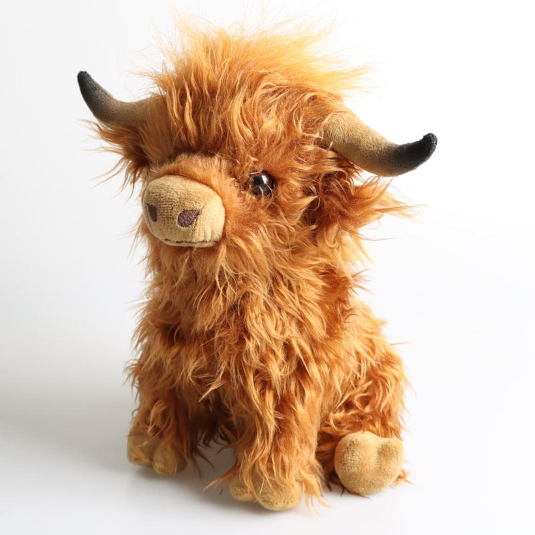 Cow plush toy with embroidered face details