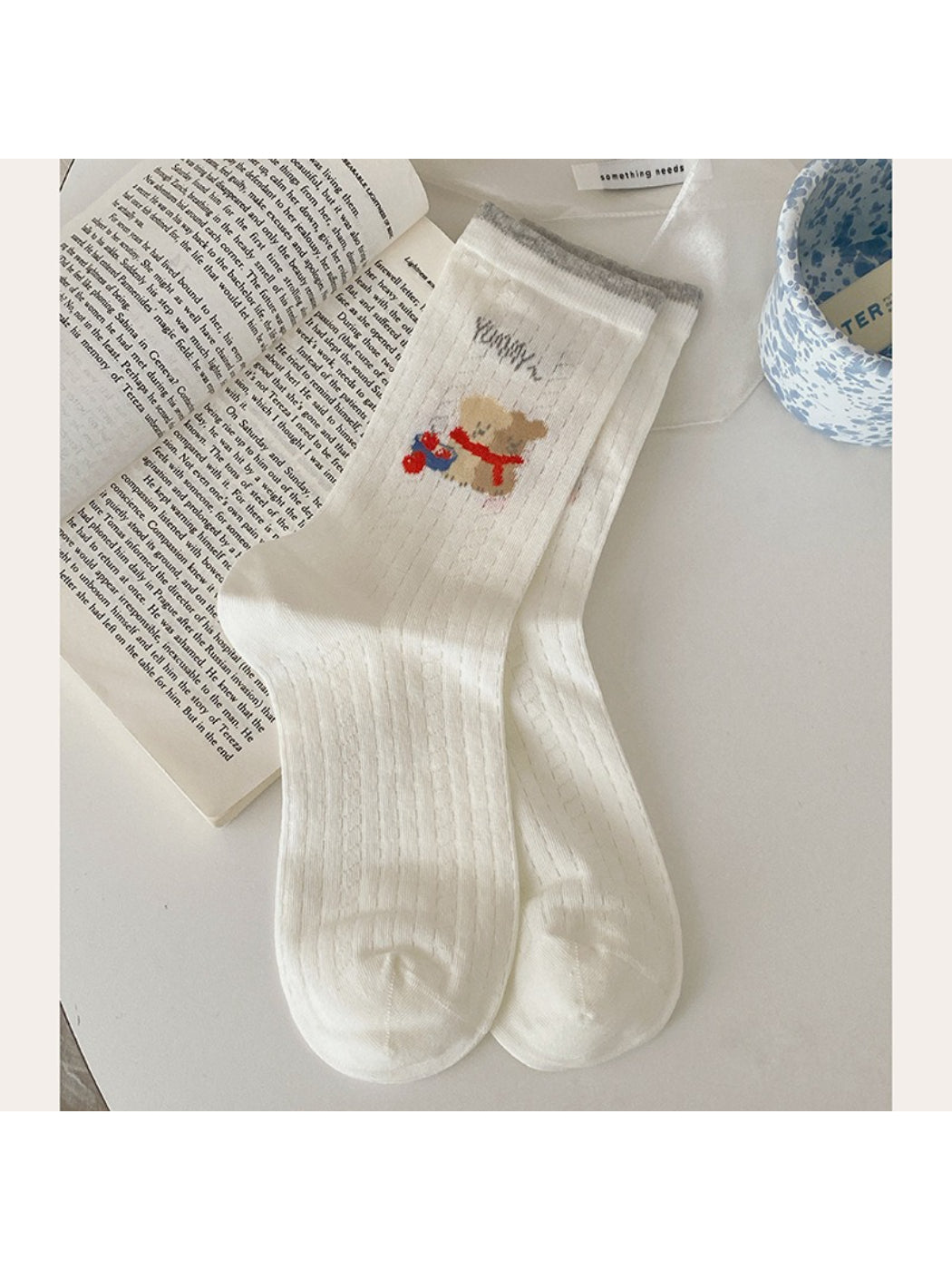 Rufia Playful Star Puppy crew socks displayed flat showing full pattern