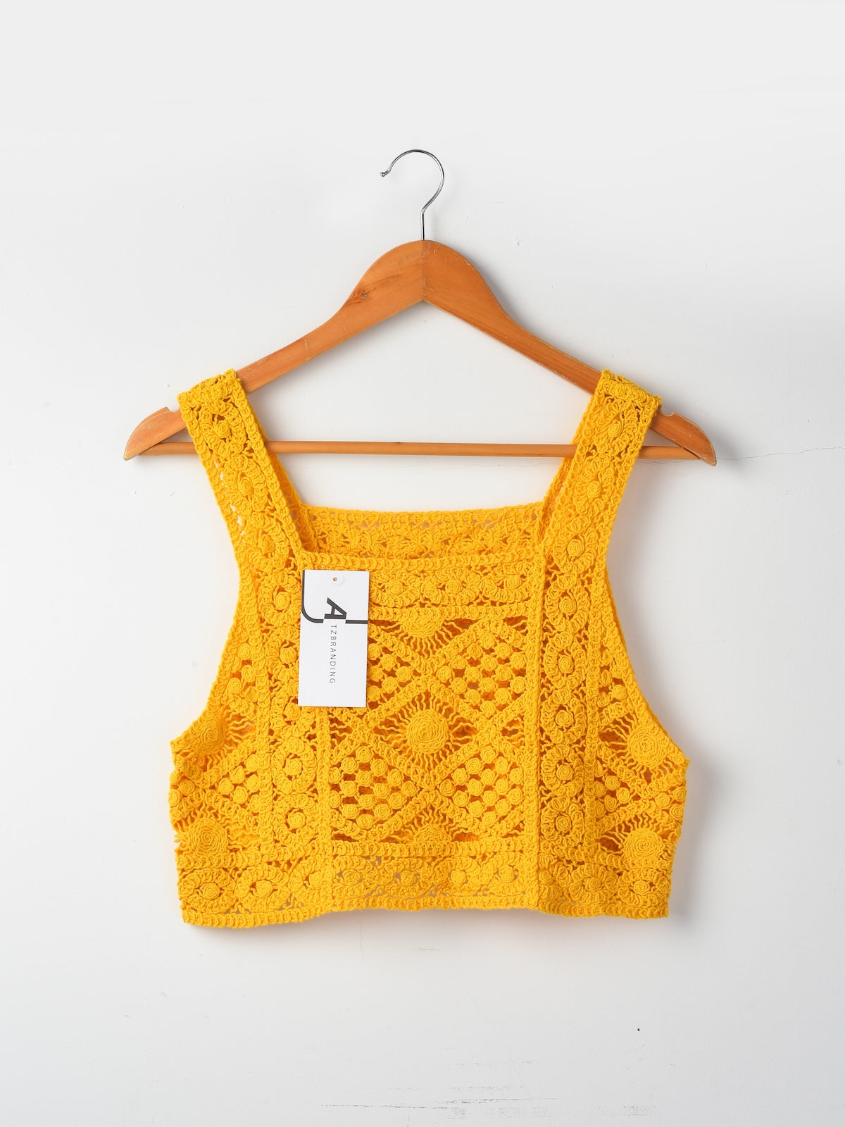 Close-up of crochet pattern on Crosa vintage camisole tank top