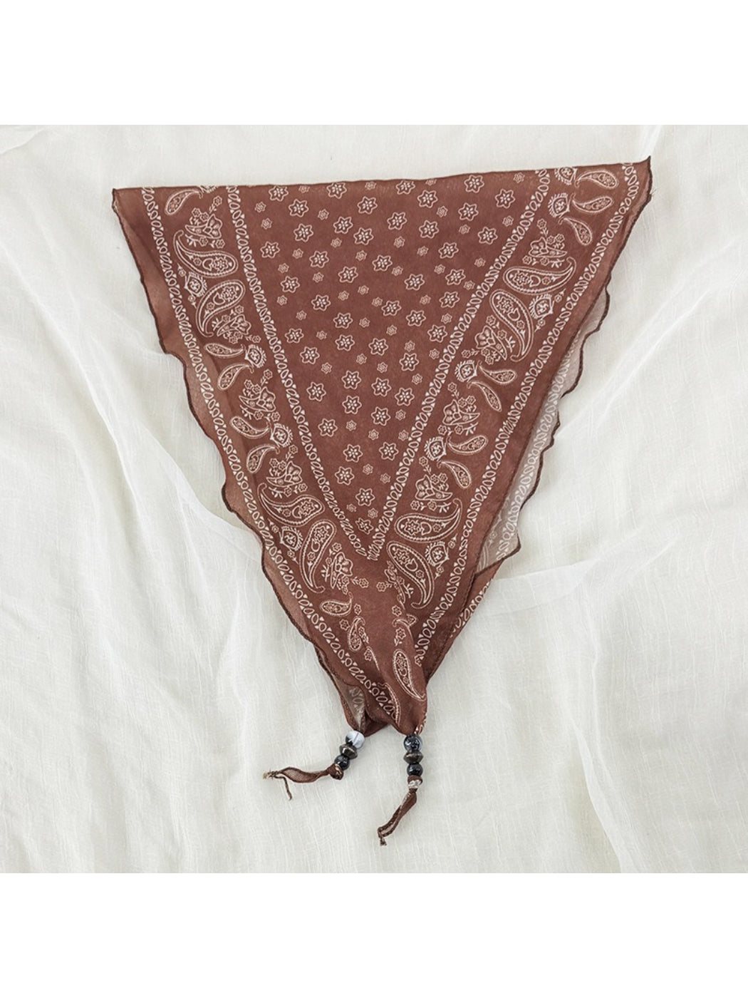 Model styling Scarvii vintage bandana headscarf as a neck scarf