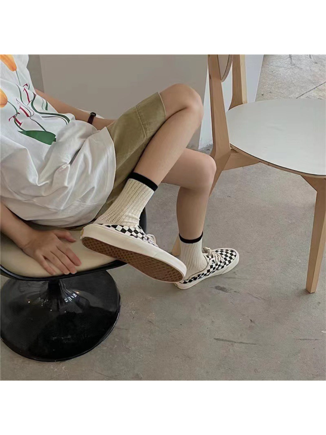 Model wearing Rufia mesh color block mid-calf socks styled with casual footwear