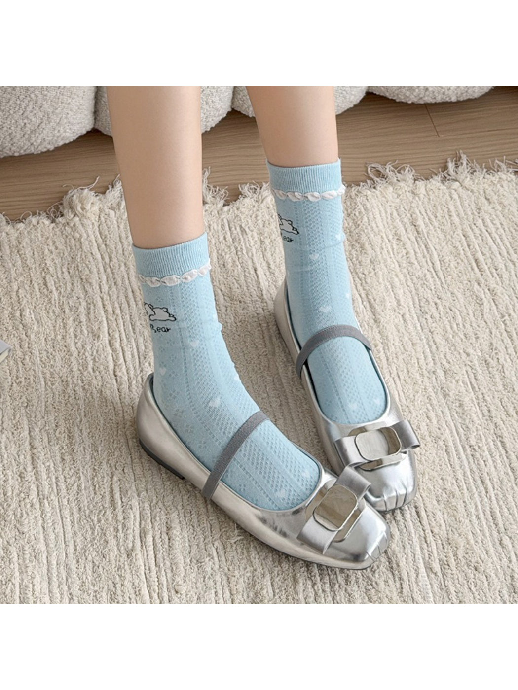 Rufia crew socks worn on feet, highlighting blue heel and toe areas
