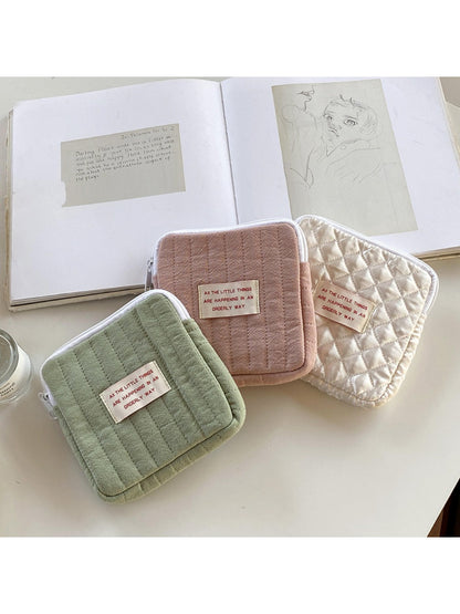 Close-up of Cosbai mini storage pouch featuring cartoon print and compact size