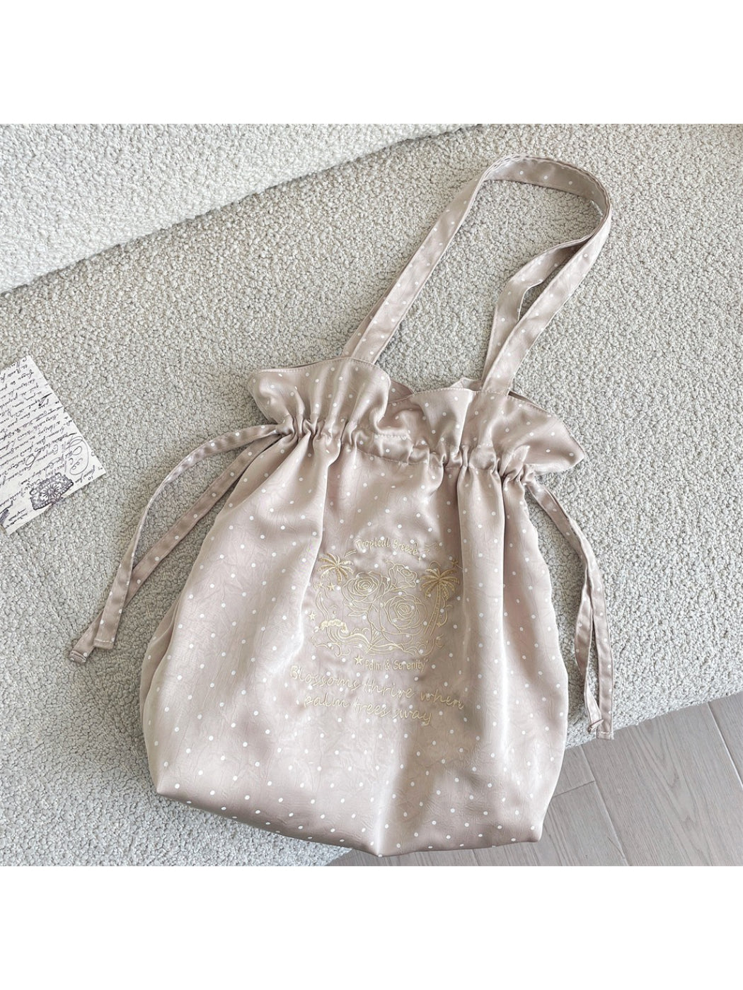 Close-up of Cosbai shoulder bag polka dot fabric and drawstring detail