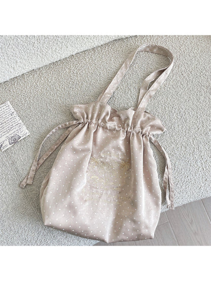Close-up of Cosbai shoulder bag polka dot fabric and drawstring detail