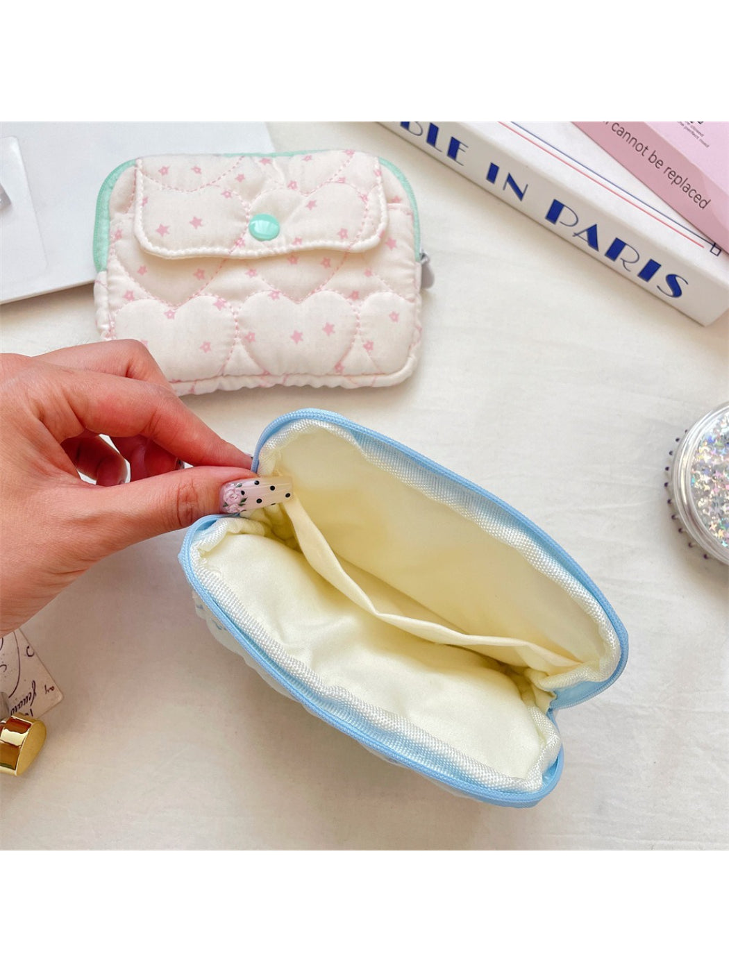 Side view of the Cosbai Quilted Heart Mini Card Pouch highlighting its slim profile