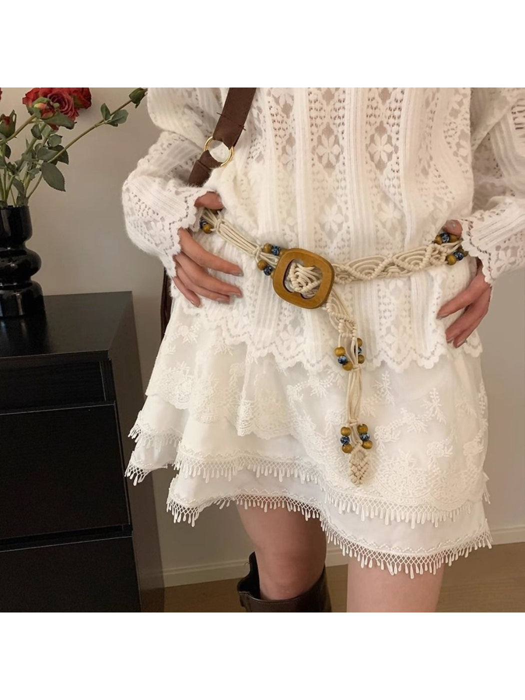 Close-up of Beco braided knot square buckle belt in natural tan color