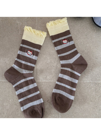 Pair of Rufia embroidered lace mesh mid-calf socks displayed on a flat surface
