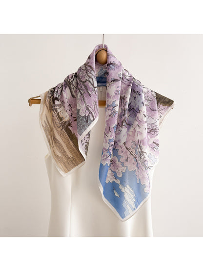 Scarvii scarf draped over a chair highlighting the botanical print and fabric texture