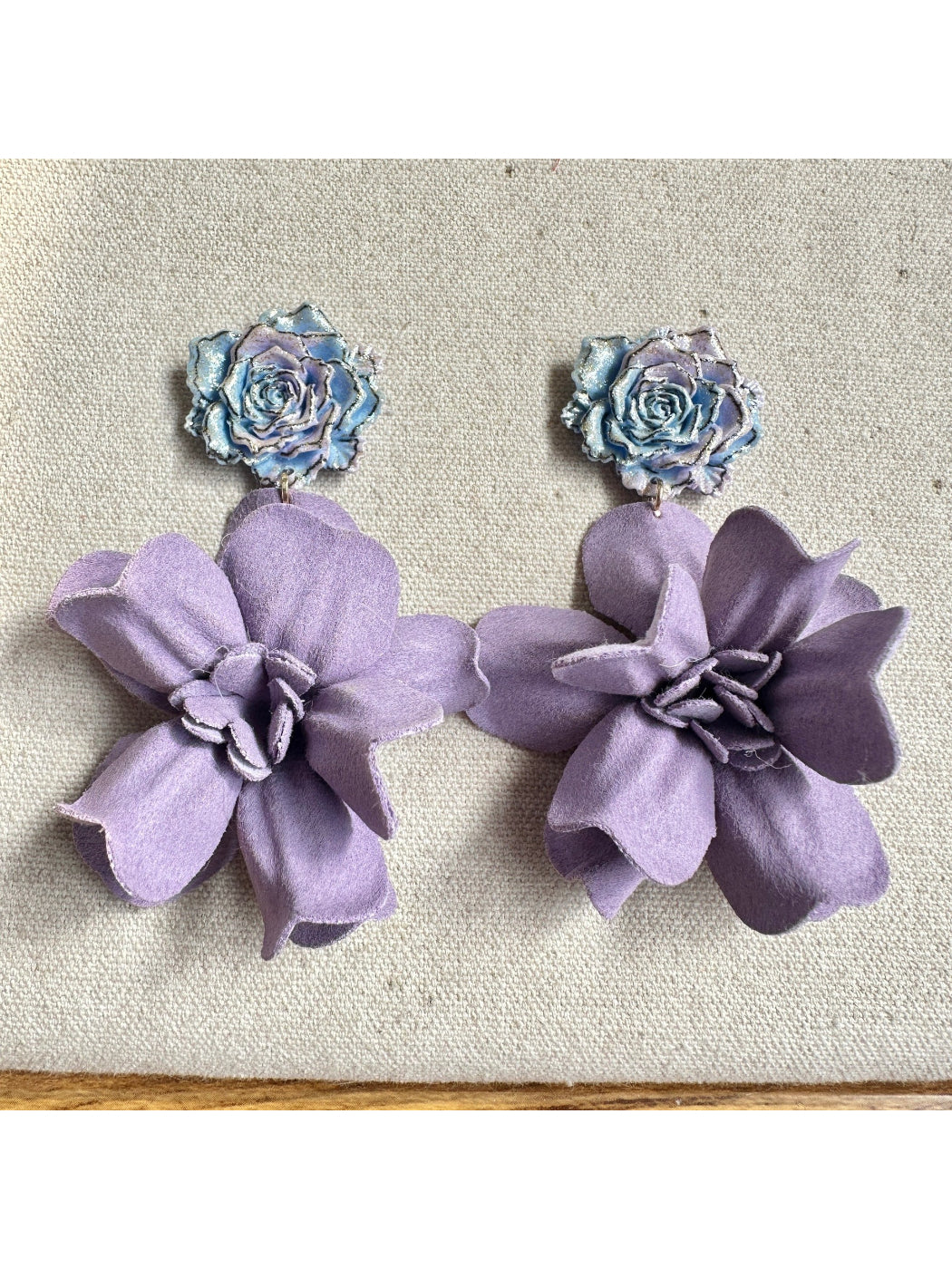Earwish purple floral drop earrings displayed on a white background