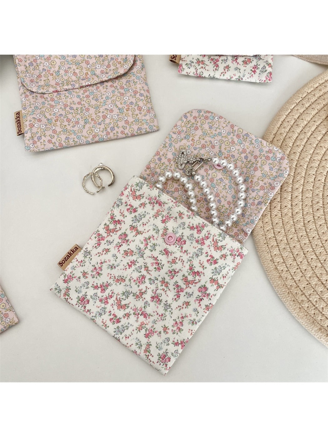 Cosbai Floral Print Coin Pouch held in hand showing size and floral design