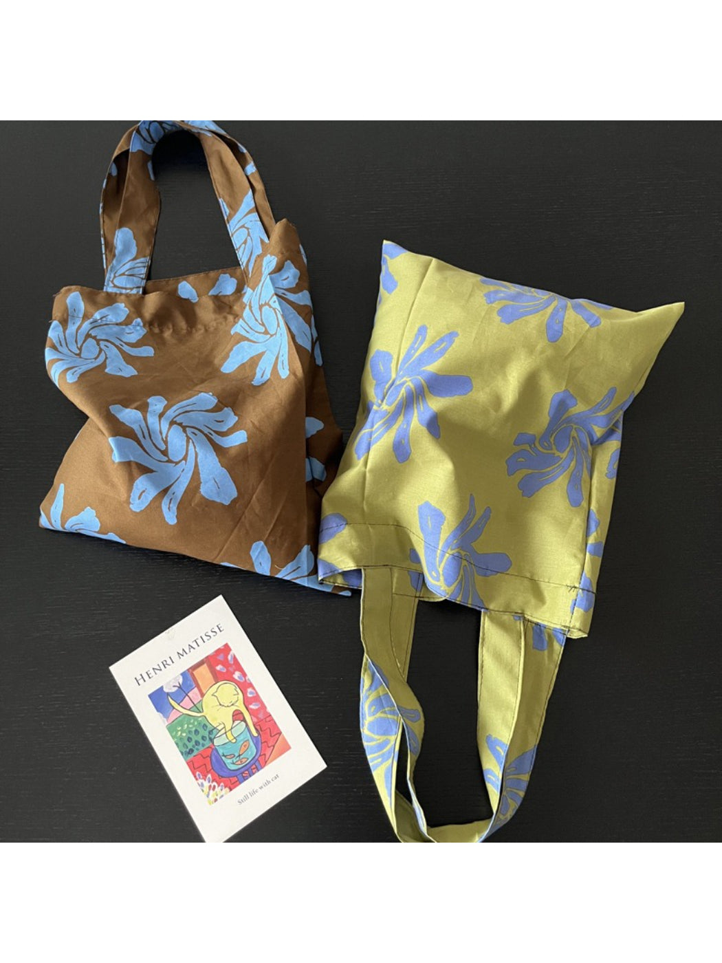 Cosbai tote bag with abstract floral print shown from side angle