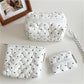 Close-up of the quilted dot texture on the Cosbai cosmetic bag