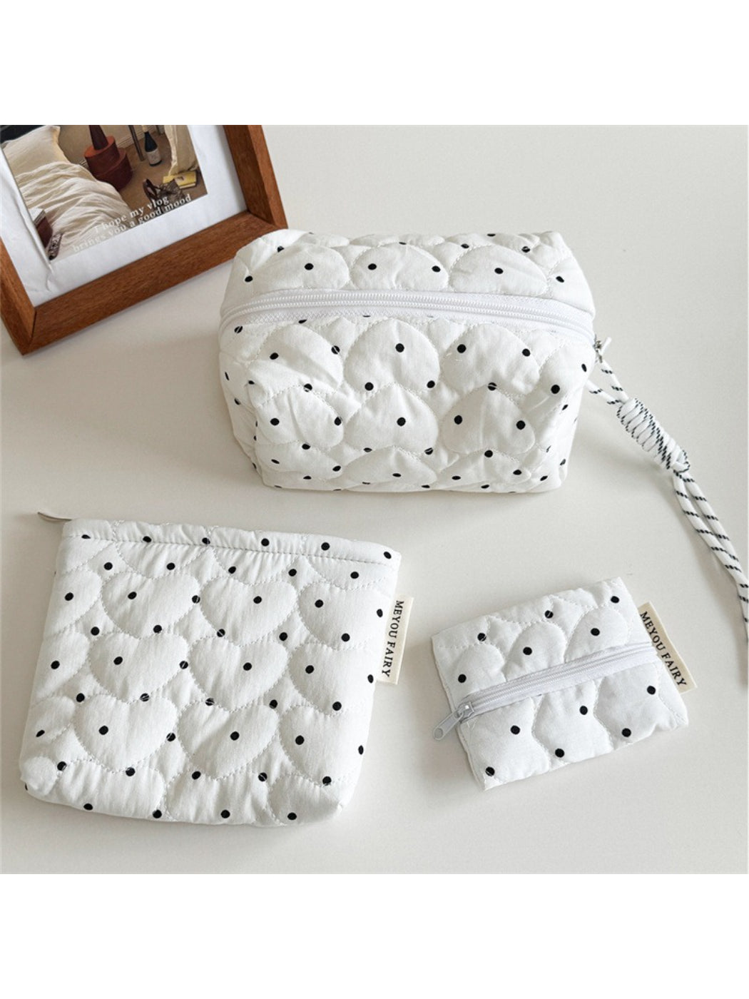 Close-up of the quilted dot texture on the Cosbai cosmetic bag