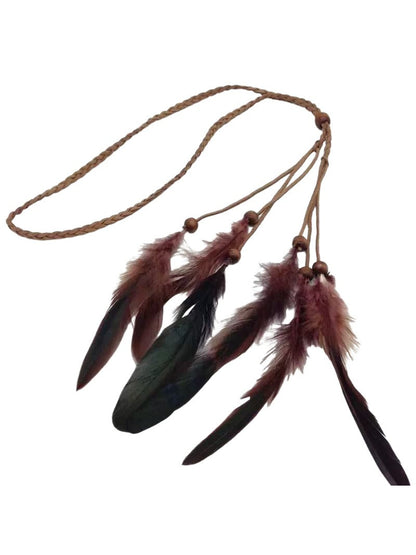 Boho style Hairish headband with feather hairpiece laid flat on surface