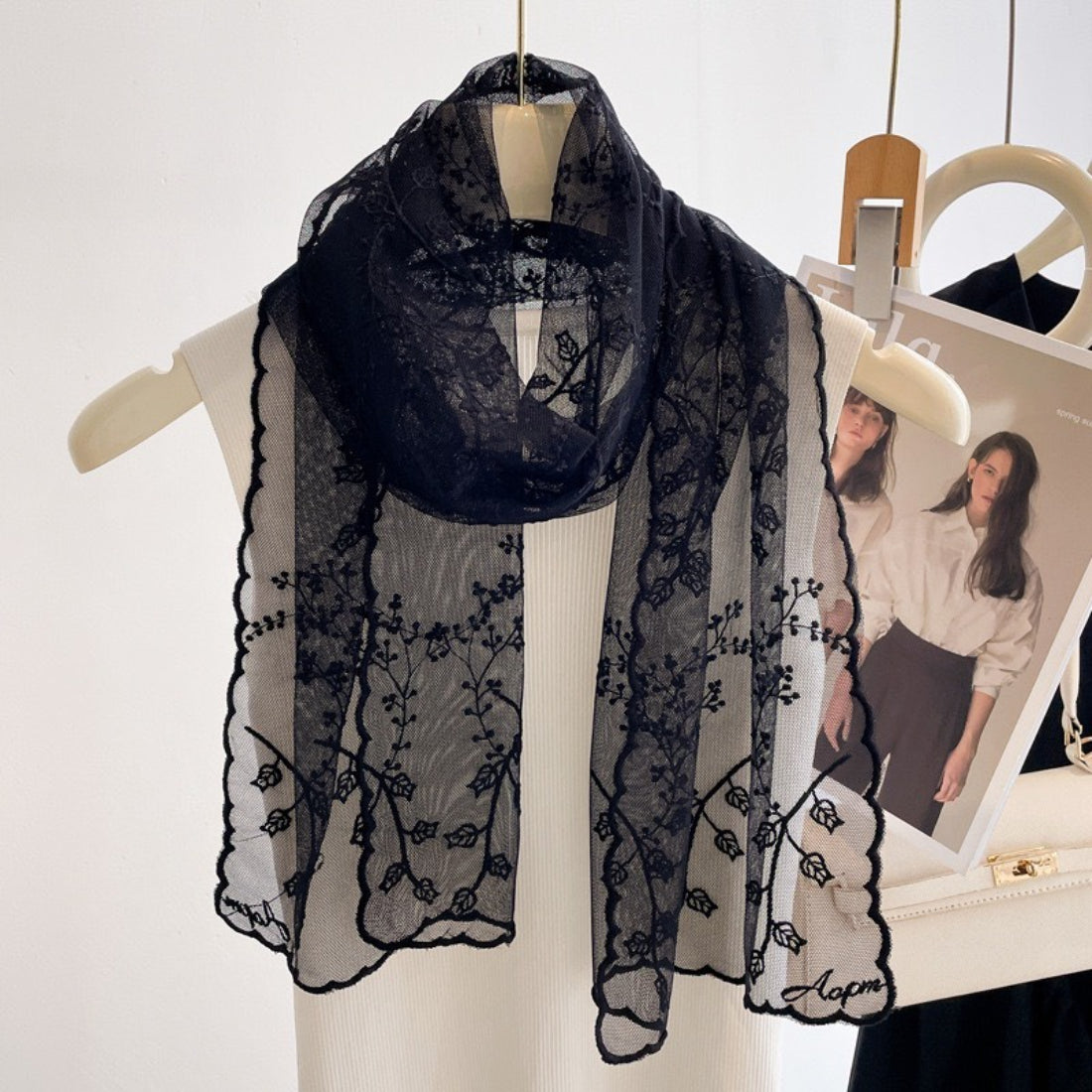 Romantic sheer scarf with delicate floral embroidery in soft pastel colors
