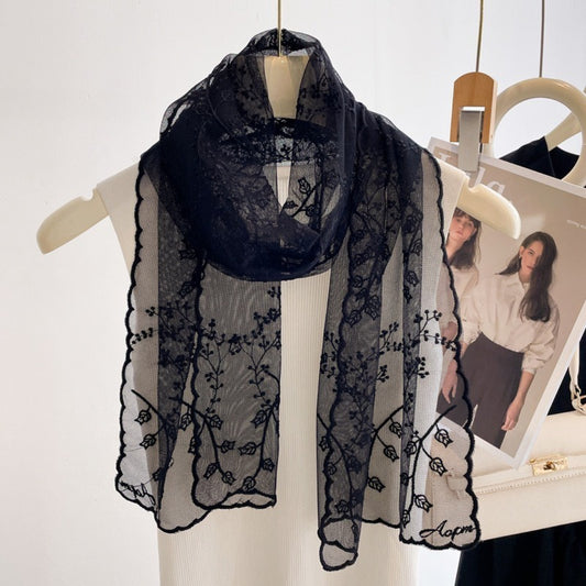 Romantic sheer scarf with delicate floral embroidery in soft pastel colors