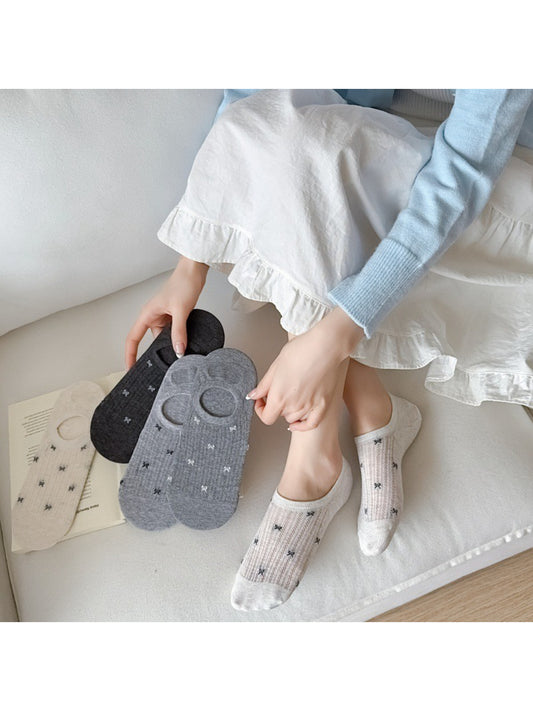 Pair of Rufia no show socks in sheer knit fabric with heel detail heel detail