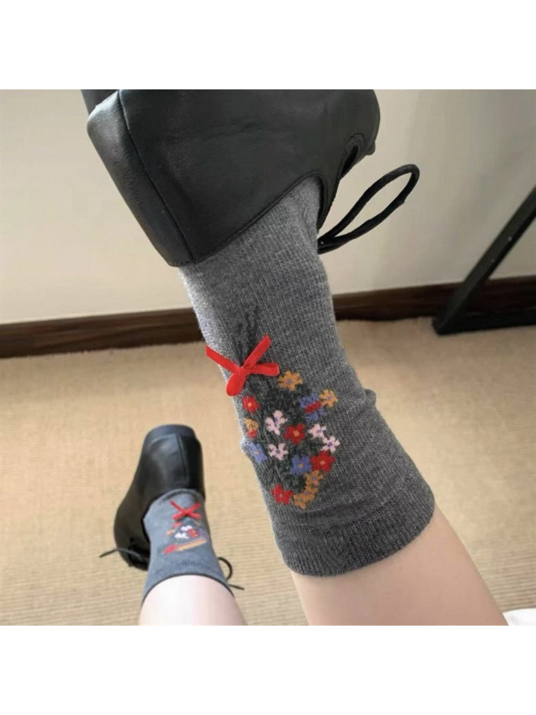 Side view of Rufia floral bow ankle socks worn on foot