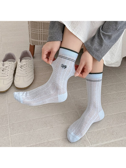 Close-up of Rufia crew sock cuff showing vintage stripe pattern in earth tones
