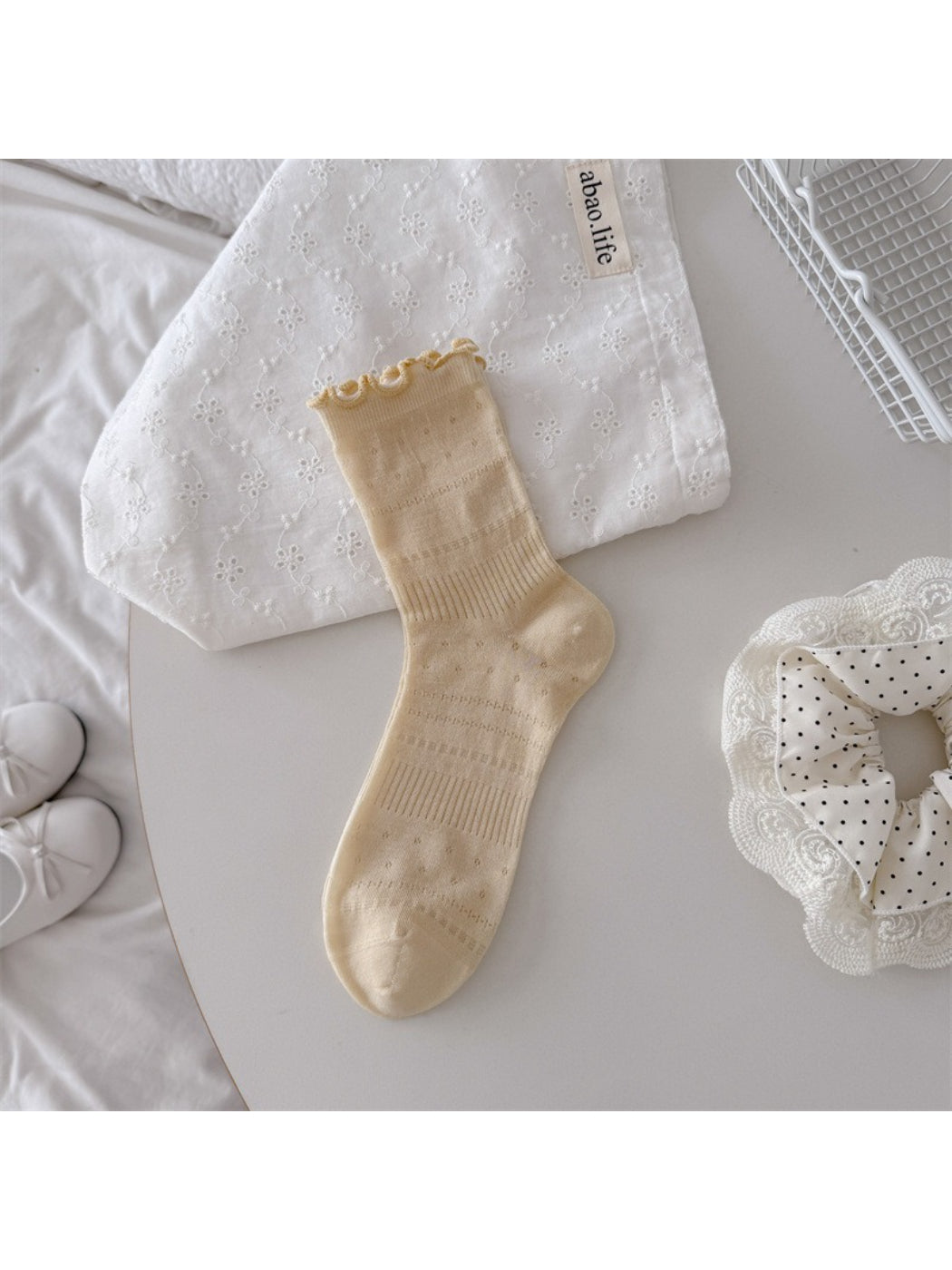 Rufia soft ruffle pointelle crew socks styled with casual footwear