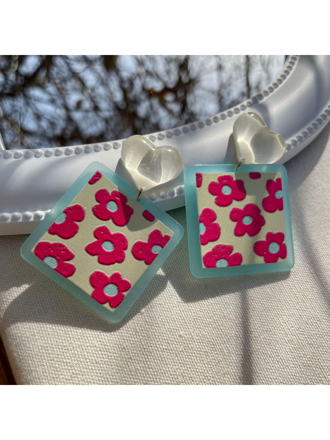 Earwish Heart Top Floral Drop Earrings worn on ear highlighting delicate floral drop and heart stud