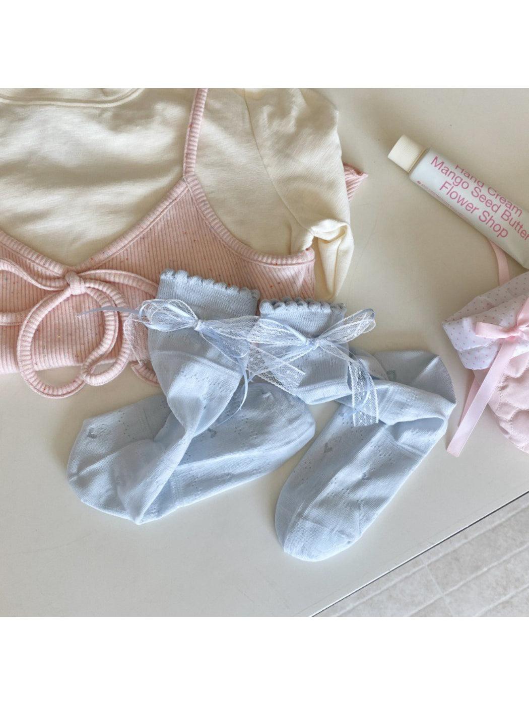Rufia Romantic Ribbon Trim Socks paired with a skirt in a lifestyle setting