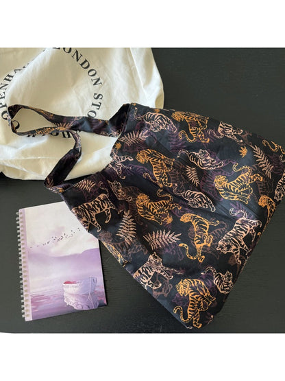 Close-up of tiger print pattern and stitching details on Cosbai slouch shoulder bag