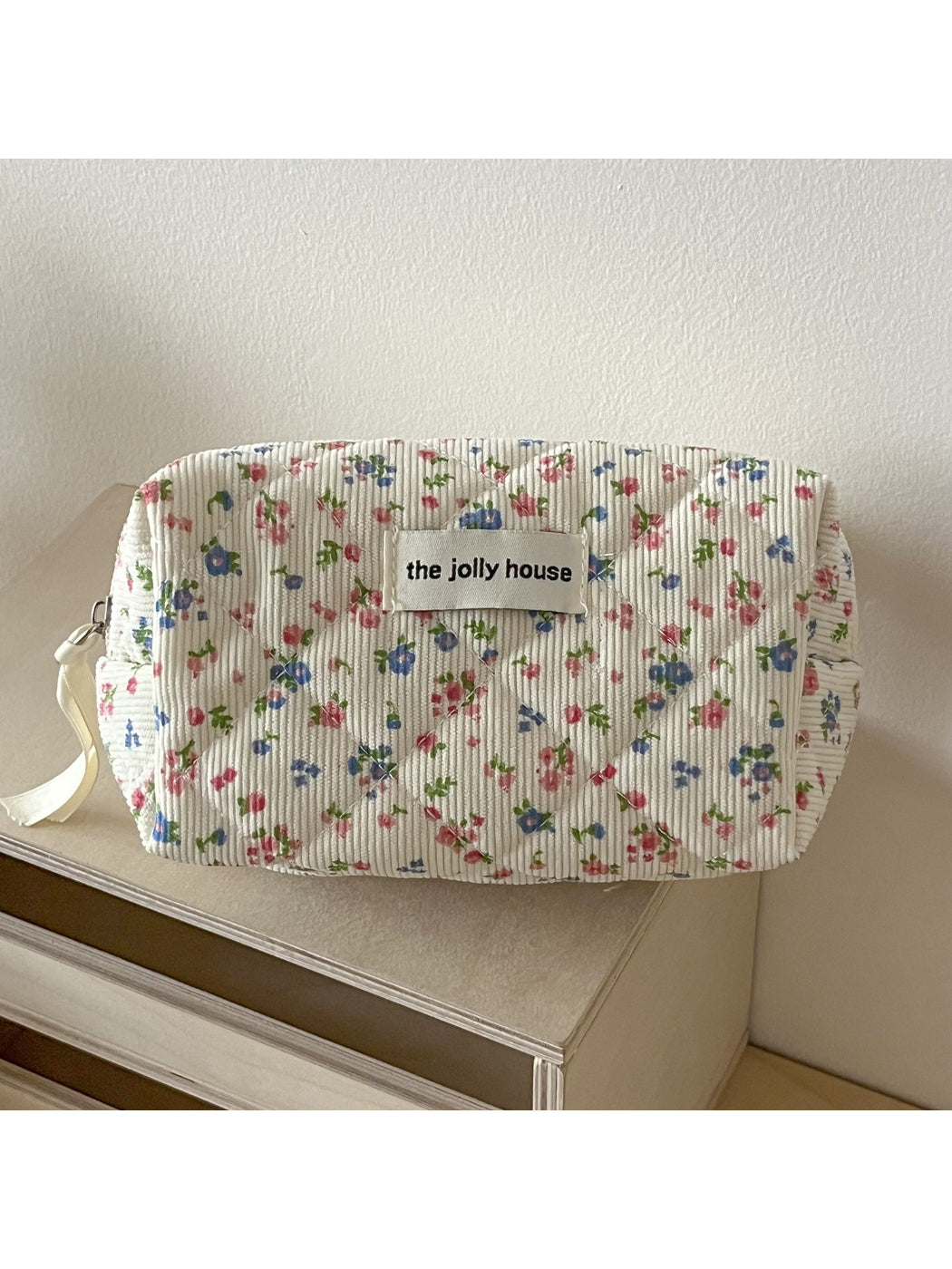 Cosbai floral toiletry bag open, displaying spacious interior with fabric lining