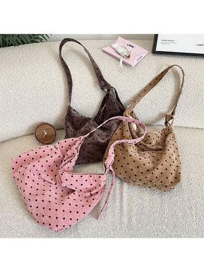 Cosbai Polka Dot Crossbody Slouchy Bag front view with black and white polka dot pattern