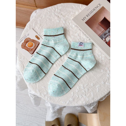Rufia speckled knit crew socks paired with casual outfit in lifestyle setting