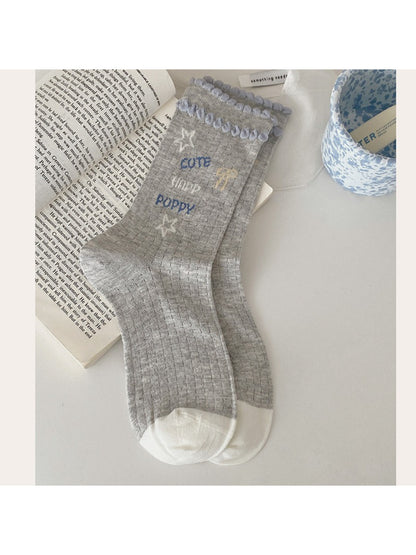 Rufia Playful Star Puppy crew socks packaging with brand label visible