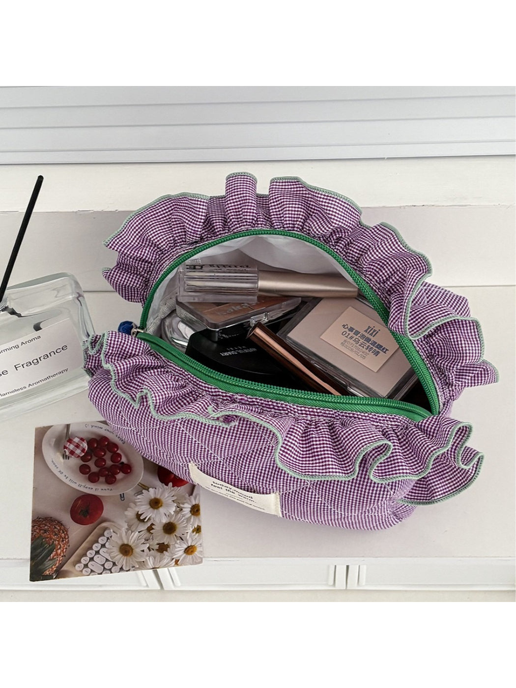 Close-up of ruffle trim detail on Cosbai gingham makeup bag