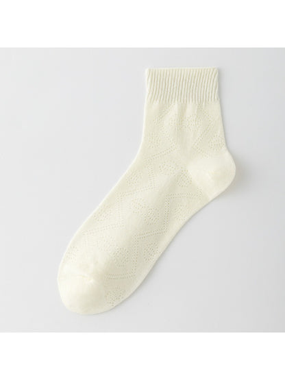 Pair of Rufia Pointelle Ribbon Crew Socks displayed flat with ribbon accents