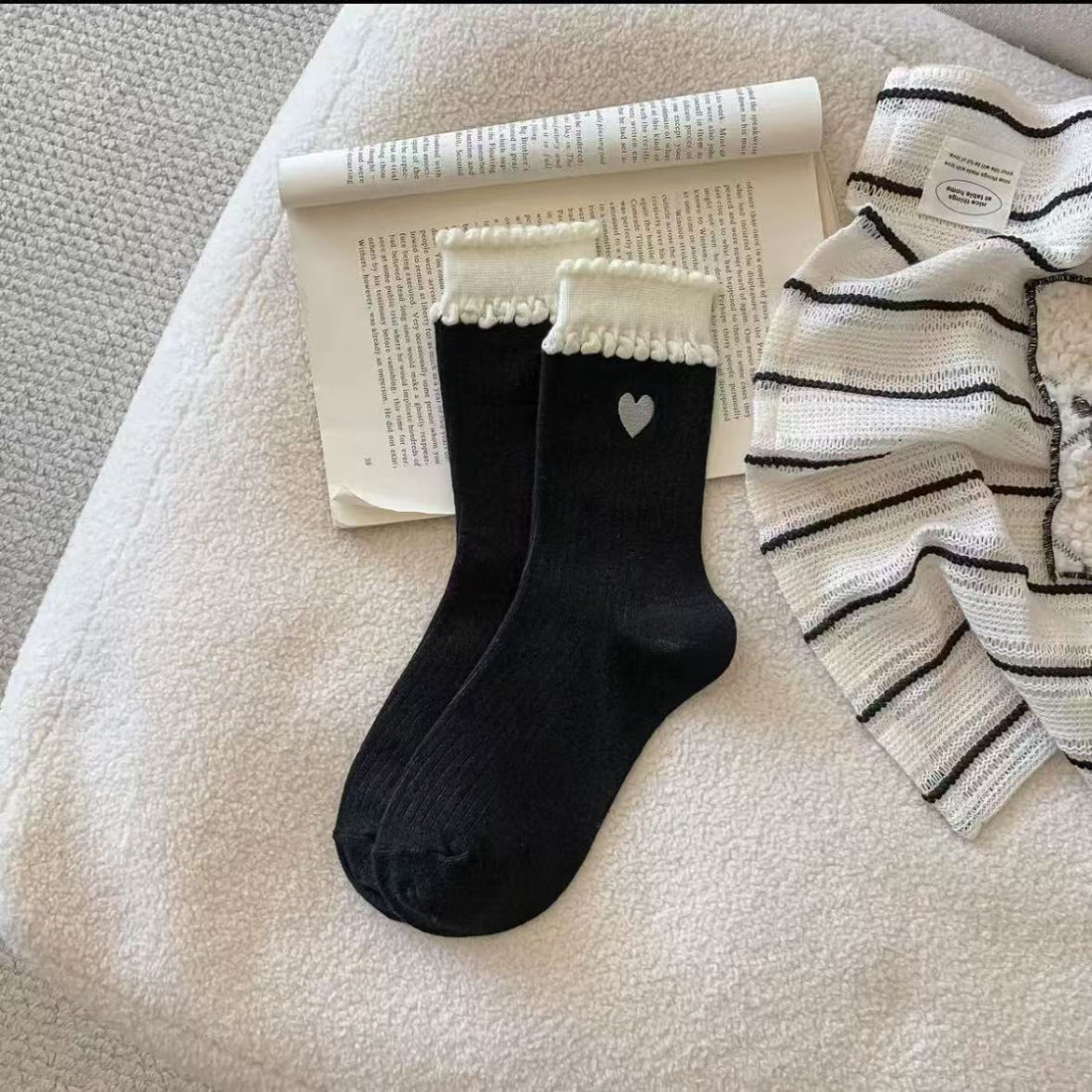 Rufia embroidered heart crew socks displayed with one sock folded over