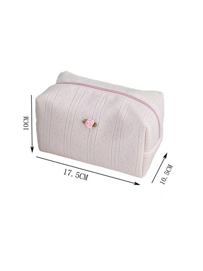 Cosbai cosmetic pouch next to makeup brushes and accessories