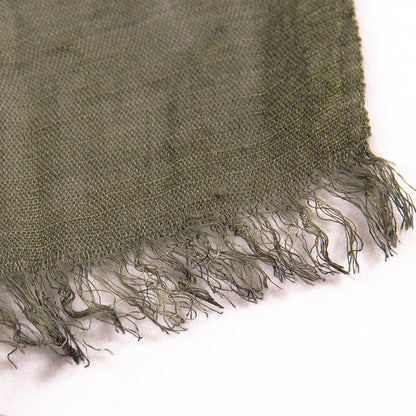 Scarvii scarf draped over a chair showcasing its length and contrast style