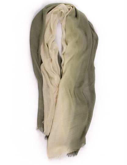 Model wearing Scarvii long scarf styled over a white blouse with black pants
