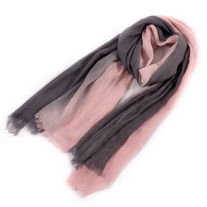 Scarvii scarf displayed on a wooden surface highlighting fabric details