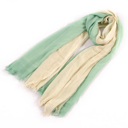 Close-up of scarf edges showing fine stitching and contrast colors