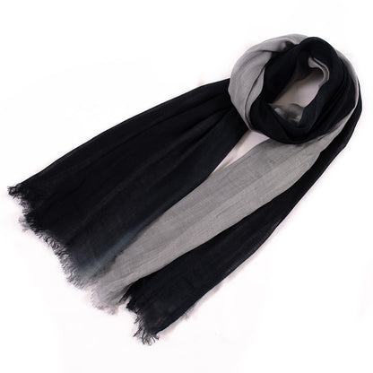 Model adjusting Scarvii scarf around the neck wearing a casual outfit