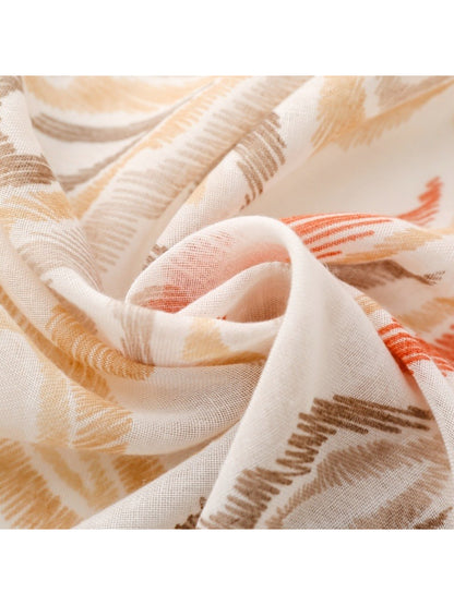 Scarvii scarf draped over shoulder highlighting soft fabric and paisley print